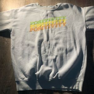 Light blue pull over with positivity